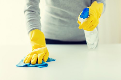 Commercial cleaner in Finchley maintaining a neat office workspace