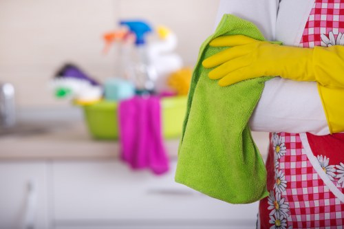 Cleaning technician preparing carpet cleaning equipment at a property