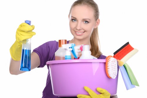 Technician moving equipment and checking a cleaned floor area