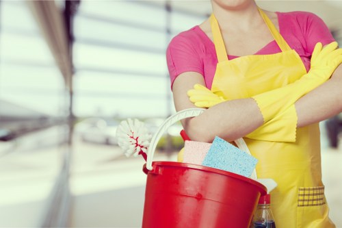 Finchley home cleaning service vacuuming and dusting a bedroom